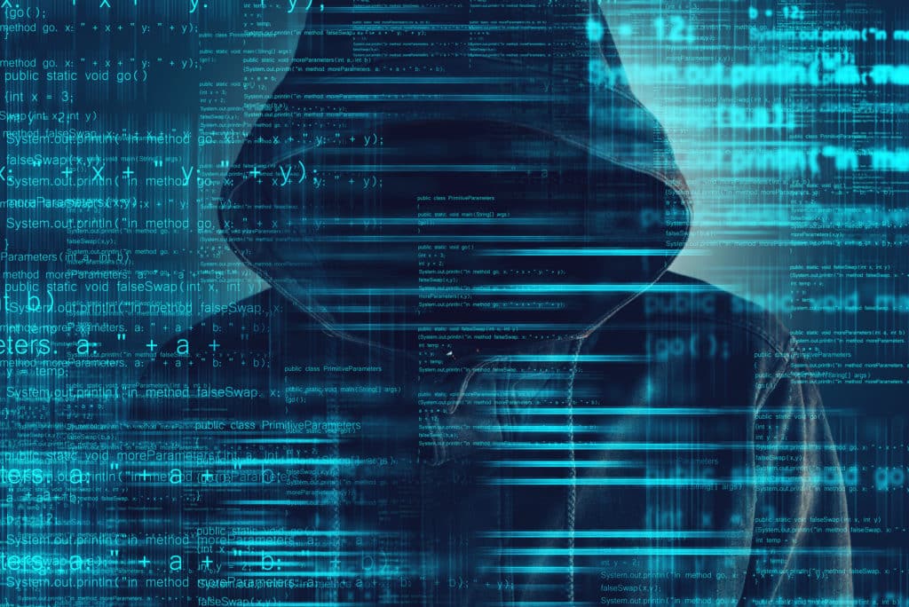 a hooded man in front of a digital background