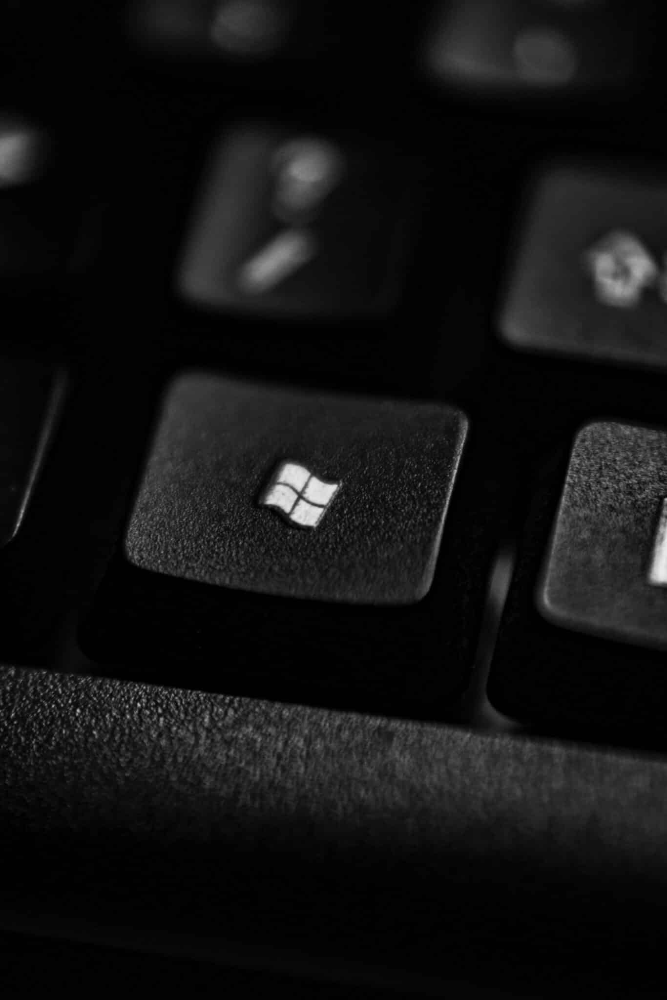 a close up view of a keyboard with the microsoft logo on it