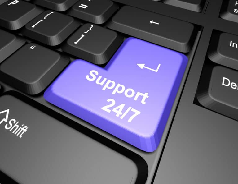 a computer keyboard with a purple button that says support 247